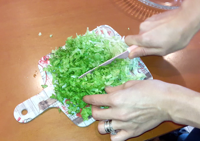 chopping greens for salad making